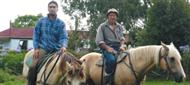 Sir Peter with his moko Te Rangi at the farm near Ruatorea